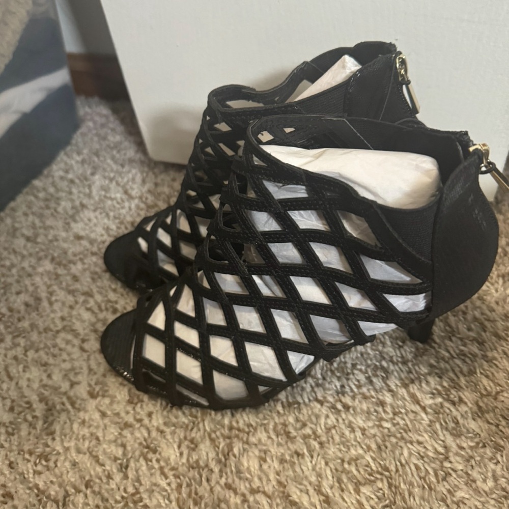 Brand New, never worn Caged black heels!!